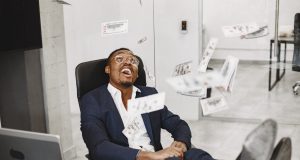 12 Passive Income Ideas You Should Try in 2026 — A Beginner’s Step-by-Step Guide african-man-black-suit-guy-sitting-table-businessman-with-money-scaled.jpg