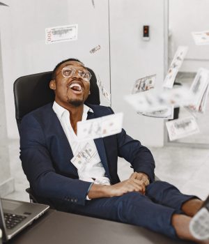 12 Passive Income Ideas You Should Try in 2026 — A Beginner’s Step-by-Step Guide african-man-black-suit-guy-sitting-table-businessman-with-money-scaled.jpg