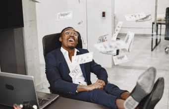 12 Passive Income Ideas You Should Try in 2026 — A Beginner’s Step-by-Step Guide african-man-black-suit-guy-sitting-table-businessman-with-money-scaled.jpg