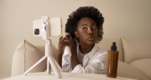 How to Get Paid on Instagram with 1000 Followers: Ultimate Guide front-view-woman-styling-hair