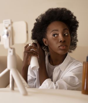 How to Get Paid on Instagram with 1000 Followers: Ultimate Guide front-view-woman-styling-hair