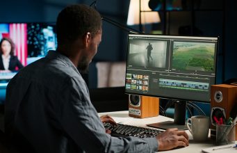 How to Start a Faceless YouTube Channel in 7 Easy Steps Before 2026 video-maker-producing-montage-with-artistic-software-color-adjustment-scaled.